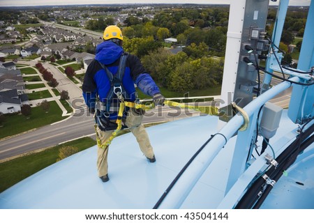 Working on the heights - top of the water tower. Royalty-Free Stock Photo #43504144