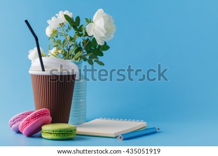 Colorful macaroons and coffee cup