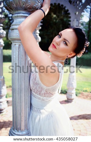 photo of bride walking in the park