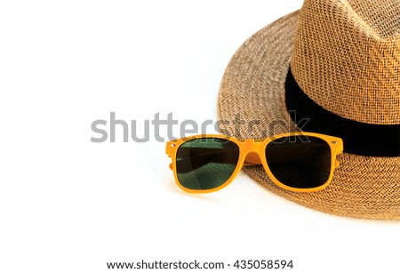 Hat and sunglasses isolated on a white background.