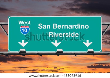 San Bernardino Riverside Interstate 10 west highway sign with sunrise sky.