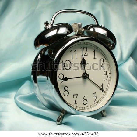 Alarm-clock on blue background