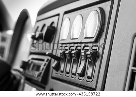 Truck interior dashboard panel in black and white - close up Royalty-Free Stock Photo #435158722