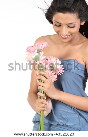   young beauty girl in gray dress  with pink daisy flowers