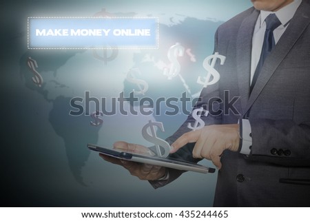 businessman holding a tablet PC with the make money button. business concept. Internet concept. Make Money Online
