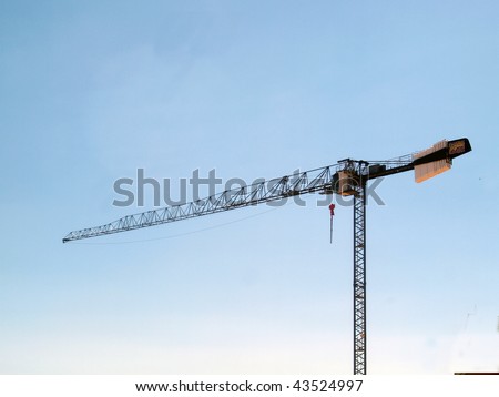 Construction crane against gradated sky