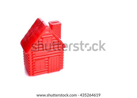 red model of house as symbol 