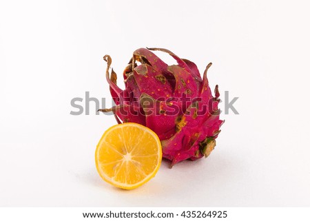 Dragon fruit and lemon isolated by white background.