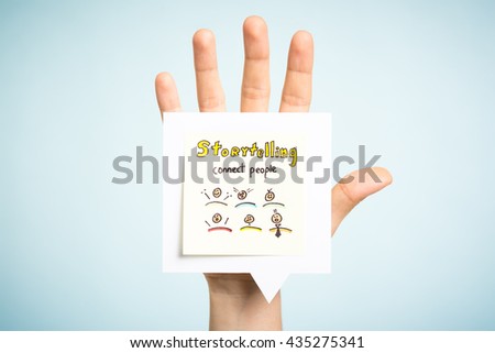 Storytelling concept. Hand up showing a paper note illustrated.