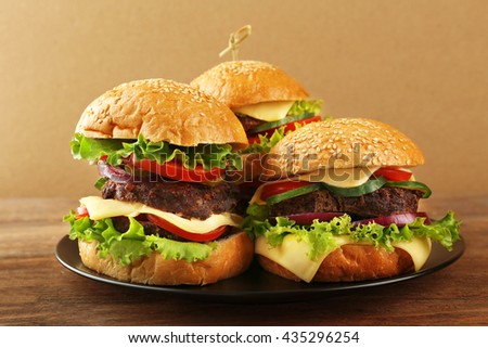 Double hamburgers on wooden table