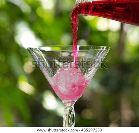 poured red water into the glass / Select focus Image