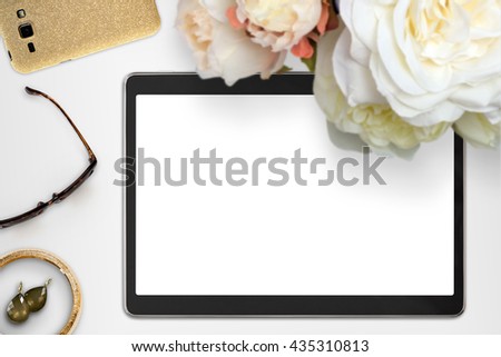 Top view scene with tablet device, jewelry and bouquet of peonies. Styled stock photography. Digital product mock-up.