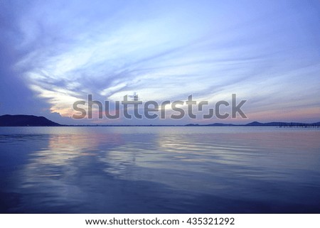 Colorful water reflective sky before sunrise at lake with silhouette downtown and Island in foreground,select focus with shallow depth of field:ideal use for background.