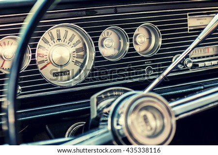 Dashboard of a classic american car from the 1960's. Royalty-Free Stock Photo #435338116