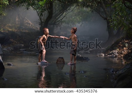 Boy fishing in creeks
