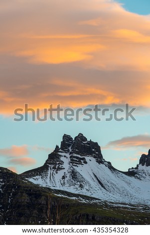 The beautiful mountain and spectacular clouds during the sunset in Stoovarfjorour town of East Iceland.