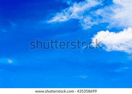 Beautiful blue sky and cloudy seen through window of an airplane