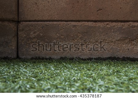 brick wall on grass field.