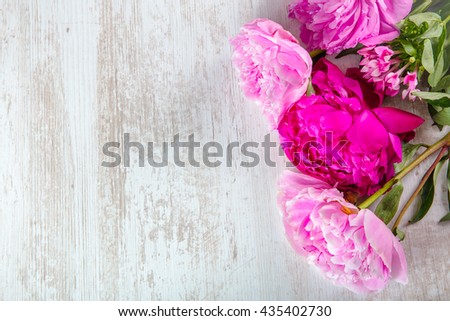 Peonies, on a wooden table