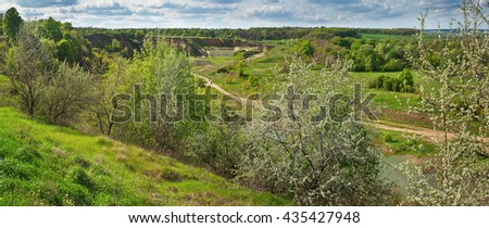 Spring landscape, banner, panorama  - a view of the green fields, hills, trees