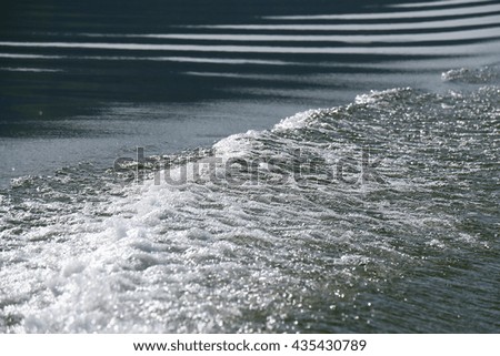 Wave from rear of the motor boat, wave on the river, water ripple