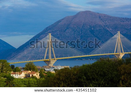 Bridge in Greece, mountains in the background.