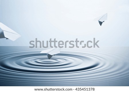 Paper planes flying on water surface