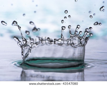 Splash blue water over white background