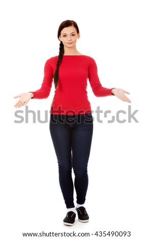 Young smiling woman presenting something 