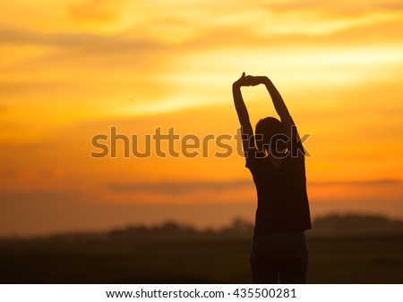Silhouette of woman relax on sunset
