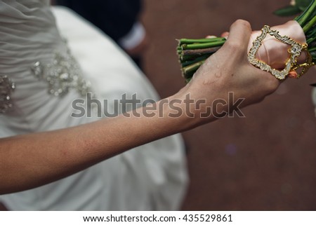 Bridal bouquet in the hands of the bride