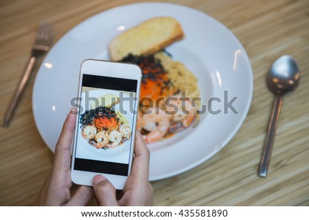 Woman hands taking food photo by mobile phone. Food photography. Share food photography.

