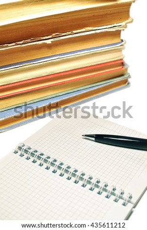  Pen, open notebook with blank pages and old books isolated on white. Education concept background