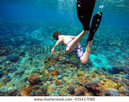Underwater shoot of a young boy snorkeling and diving in a tropical sea in Nusa penida, Indonesia, Bali Royalty-Free Stock Photo #435617080