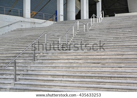 Stone stairs steps background with aluminium handle