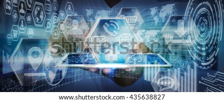 Businessman using modern digital icons interface with charts