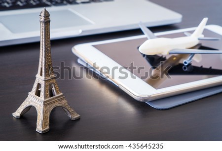 Booking Plane ticket online to Paris France using Tablet. 