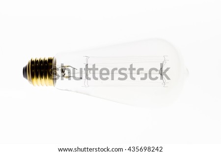 perfectly clean deco light bulb - contemporary light emitter lamp isolated on a light table, high resolution, no dust, white with gold color, like the traditional Edison bulb,  incandescent, vintage