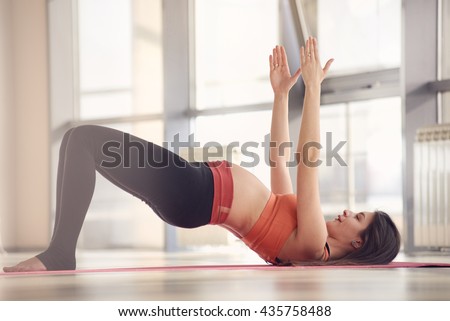 pregnant woman gym yoga exercise Royalty-Free Stock Photo #435758488