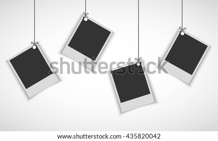 Blank photo frame hanging on line