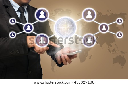 Businessman using the smart phone with the Social media symbol on ice coffee color background with world map,Elements of this image furnished by NASA, Business network concept