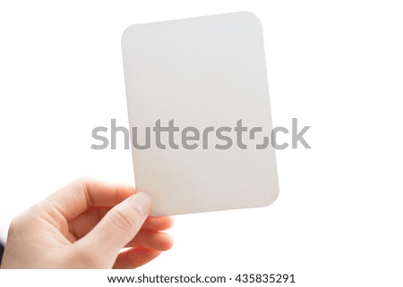 woman's hand holding white blank paper