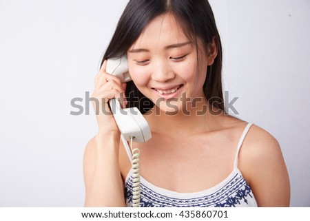 Chinese woman spoke stationary phone