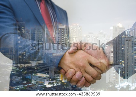 Double exposure of handshake and city business concept.