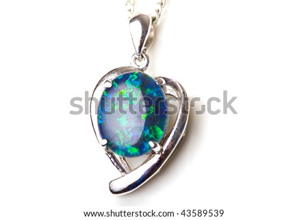 Elegant beautiful jewelry single opal stone pendant in sterling silver heart shape setting isolated