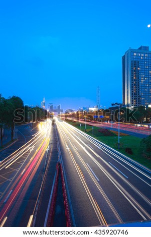 Empty road surface floor with modern city landmark building backgrounds of night scene in Shenzhen China