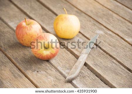Apple and knife on wooden table.Background fruit or food and background fruit for health and health care