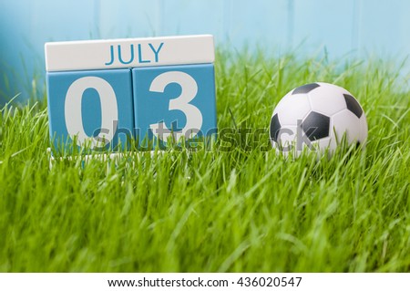 July 3rd. Image of july 3 wooden color calendar on green lawn grass background. Summer day