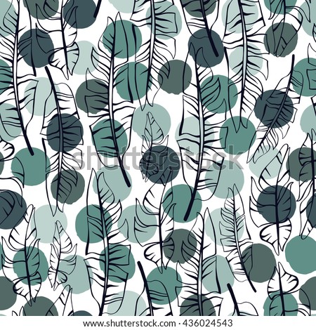 Tropical trendy seamless pattern with exotic leaves on a polka dot background.