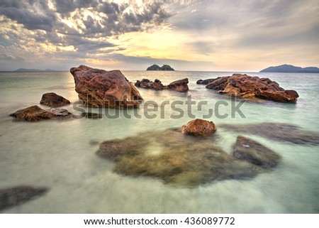 A long exposure picture of Sea stones at cloudy sunset